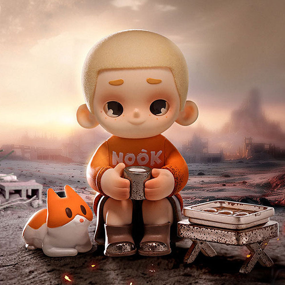Toy figure with 'Nook' shirt sitting on a rock with a fox-like creature and table in a desolate landscape.