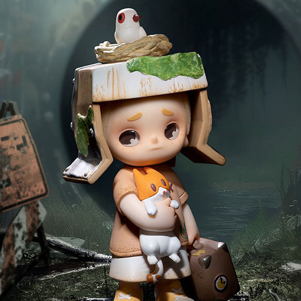 Small figurine with a helmet and backpack in a forest setting