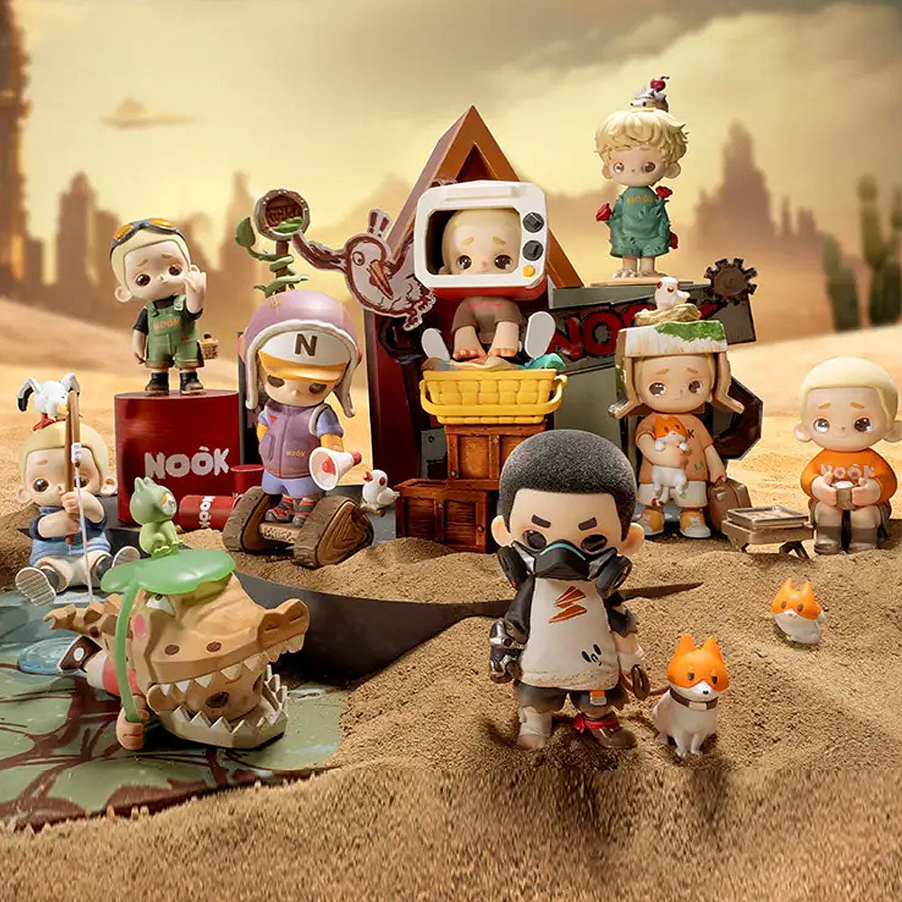 Collection of small figurines in a desert-like setting with a 'Nook' sign.
