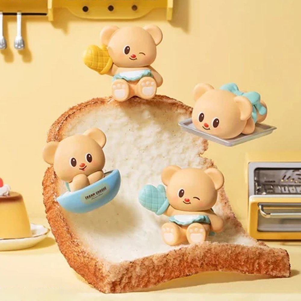 Officially licensed bakery-themed Butterbear collectible mini figures holding baking tools, wearing aprons, and posing with kitchen accessories
