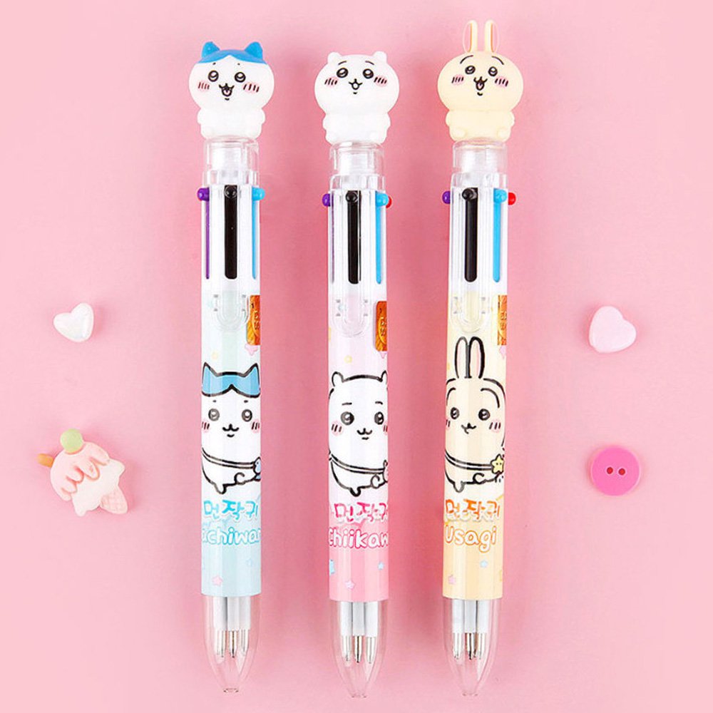 The officially licensed Chiikawa multi-color ballpoint pens in blue, pink, and yellow barrels. Each pen features a 3D character topper of Hachiware, Chiikawa, or Usagi and contains six different ink colors.