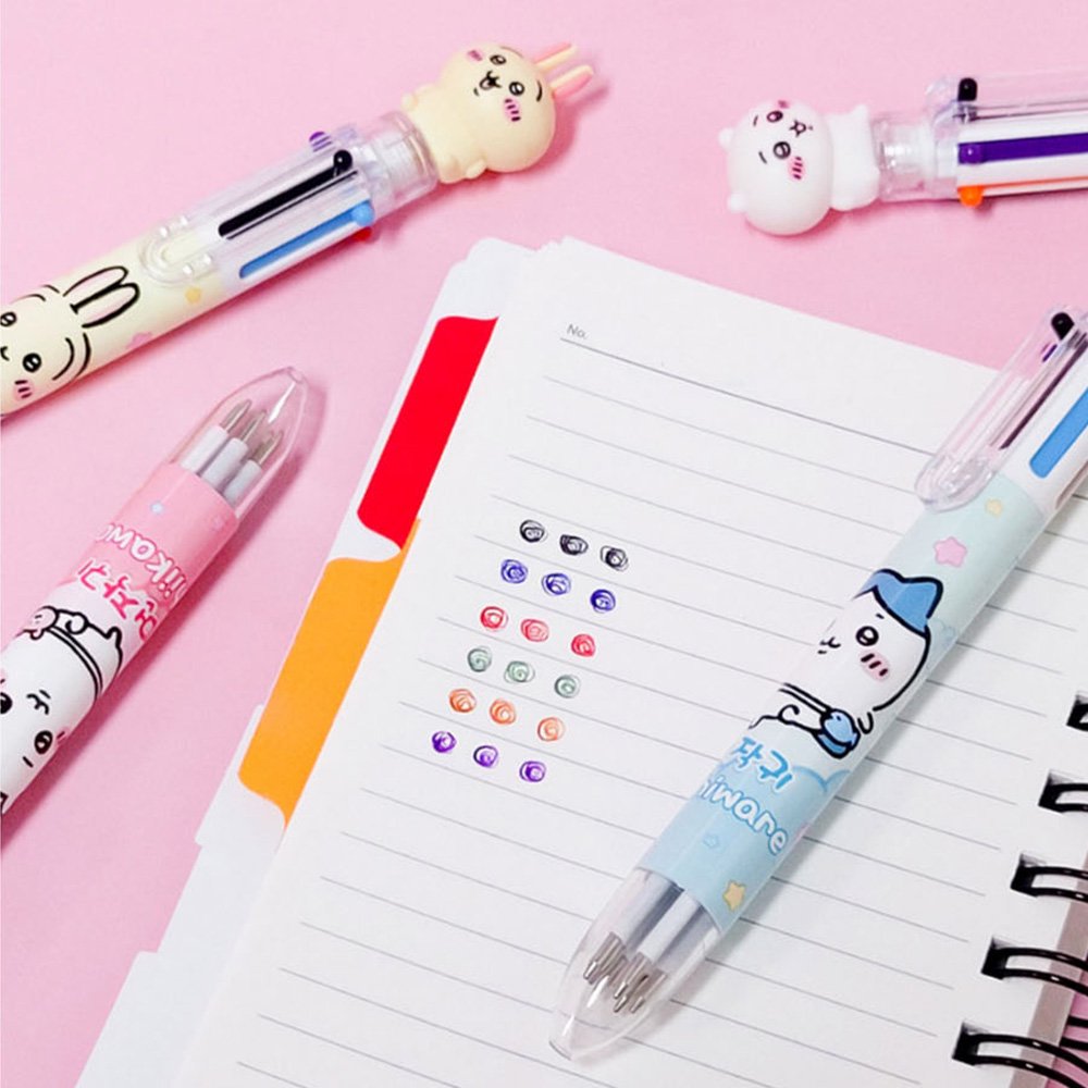 The officially licensed Chiikawa multi-color ballpoint pens in blue, pink, and yellow barrels. Each pen features a 3D character topper of Hachiware, Chiikawa, or Usagi and contains six different ink colors.