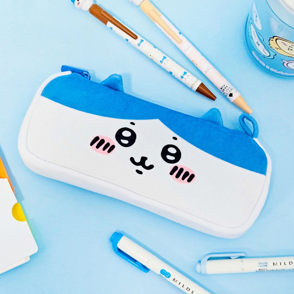 Three officially licensed plush Chiikawa character pencil cases featuring: the yellow-colored with Usagi's face and long ears; the white with Chiikawa's face; the white and blue with Hachiware's face and blue ears. Each pouch features embroidered eyes, pink cheeks, and a top zipper.