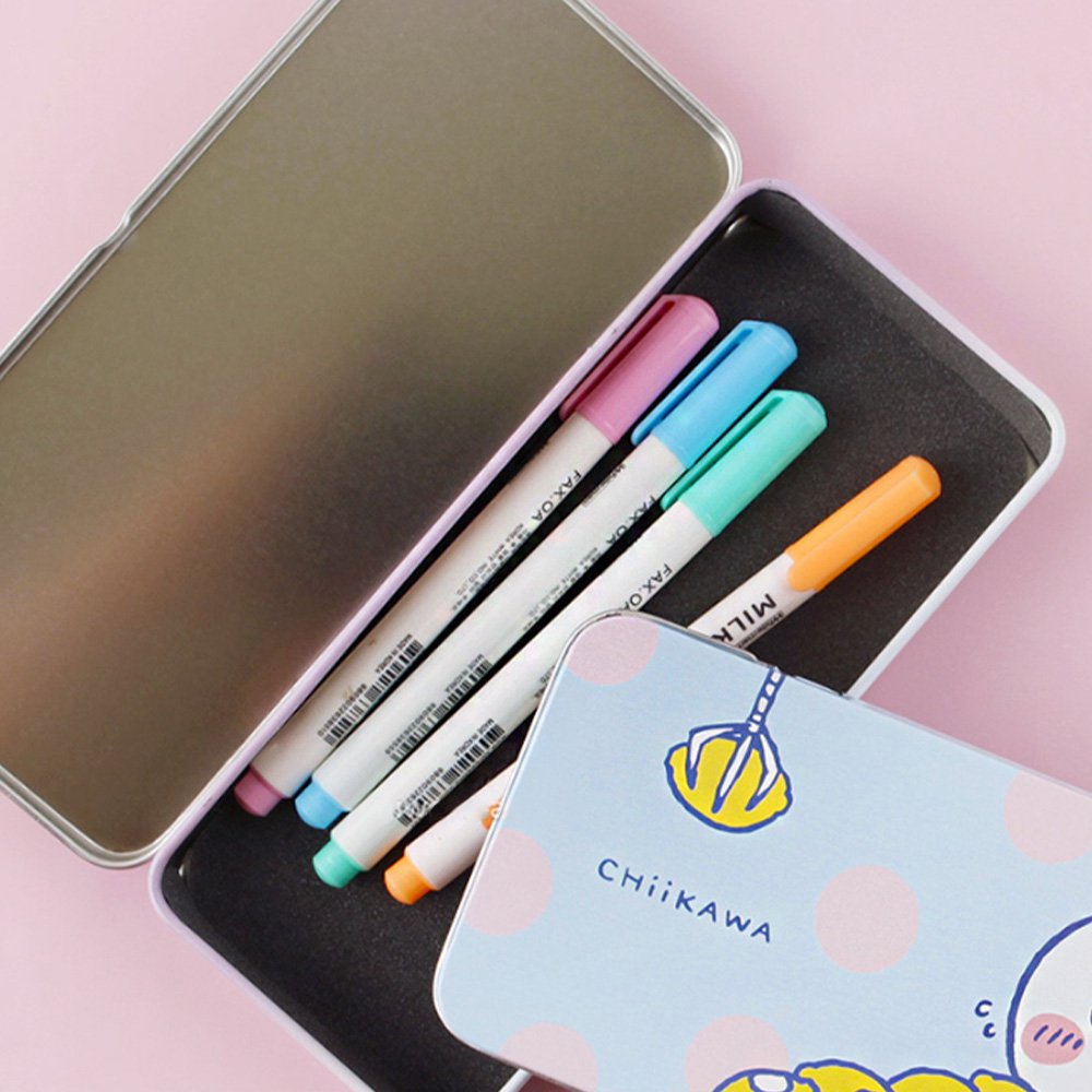 Two rectangular tin pencil cases featuring officially licensed Chiikawa artwork. One is light blue with white polka dots showing Chiikawa and a yellow claw machine hand. The other one has a pink-to-purple sunset gradient showing Chiikawa and Hachiware sitting on stumps and drinking.