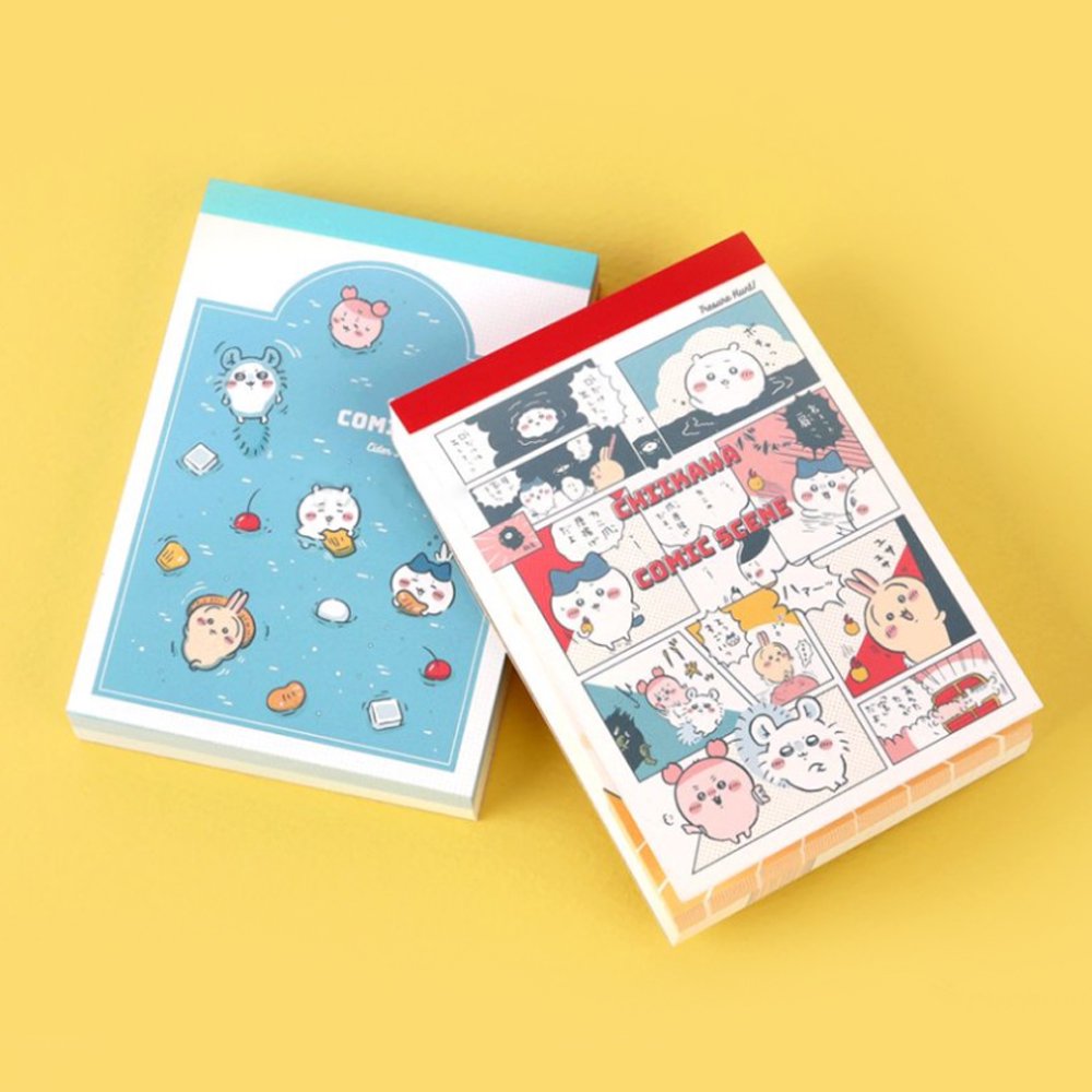 Officially licensed Chiikawa memo pads, one featuring a blue aquatic theme and the other a colorful comic book panel design. The interior pages show detailed character illustrations of Chiikawa, Hachiware, and Usagi.