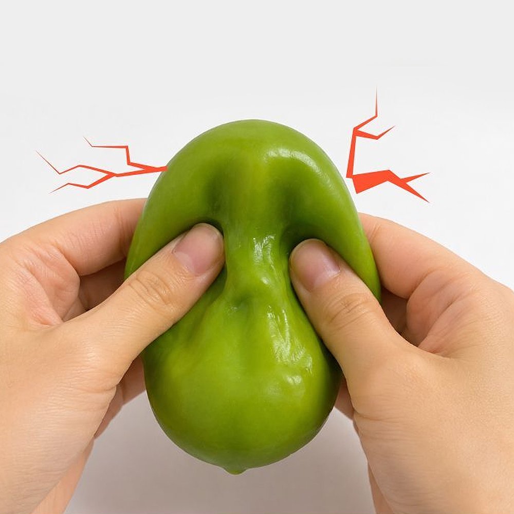 Hands squeezing a green Crunchy Mango Squishy Toy producing crisp ASMR crackle sound, featuring flexible TPR shell, color-changing chameleon effect, perfect Christmas gift and holiday stocking stuffer idea