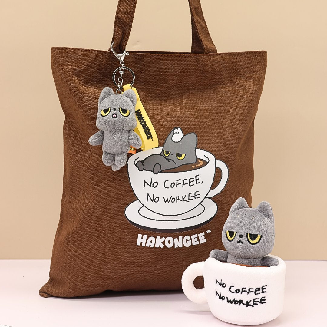 Brown tote bag with 'No Coffee, No Workee' design and matching mug, featuring black cat characters. Brand 'Hakongee' visible.