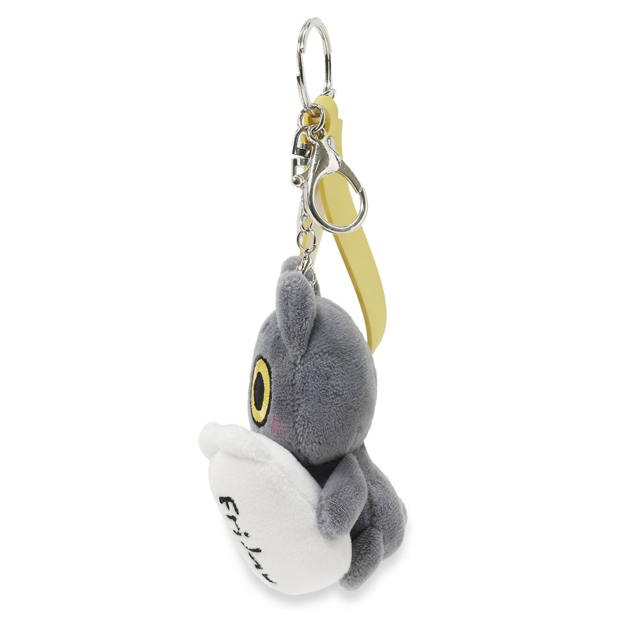 Plush keychain of a black cat creature with a yellow eye on a white background