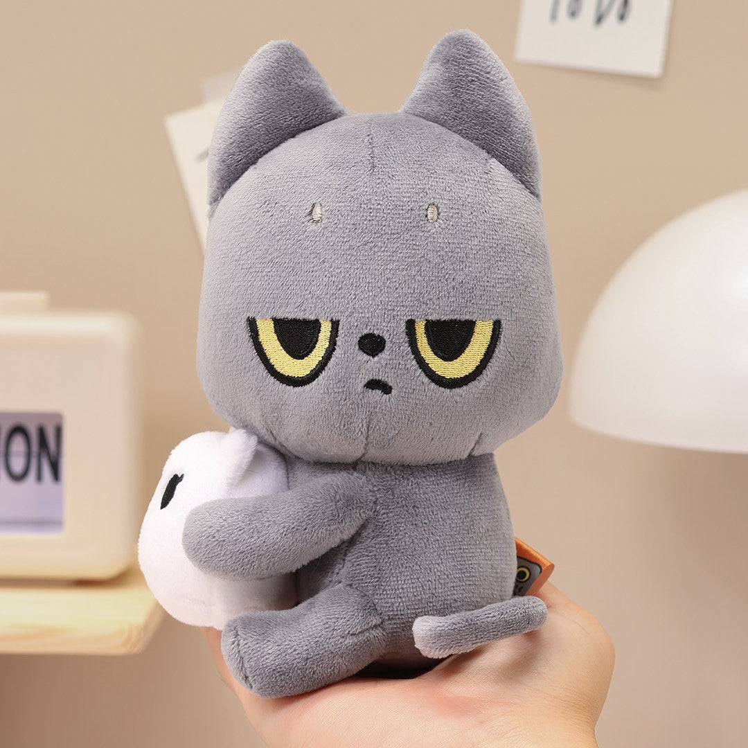 Black Cat plush cat toy held in a hand with a neutral background