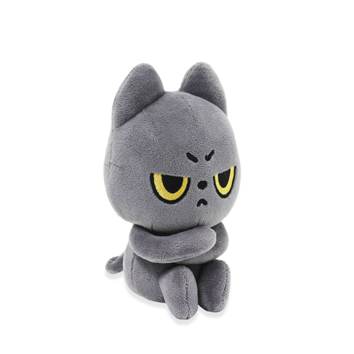 Black plush toy with angry expression on a white background