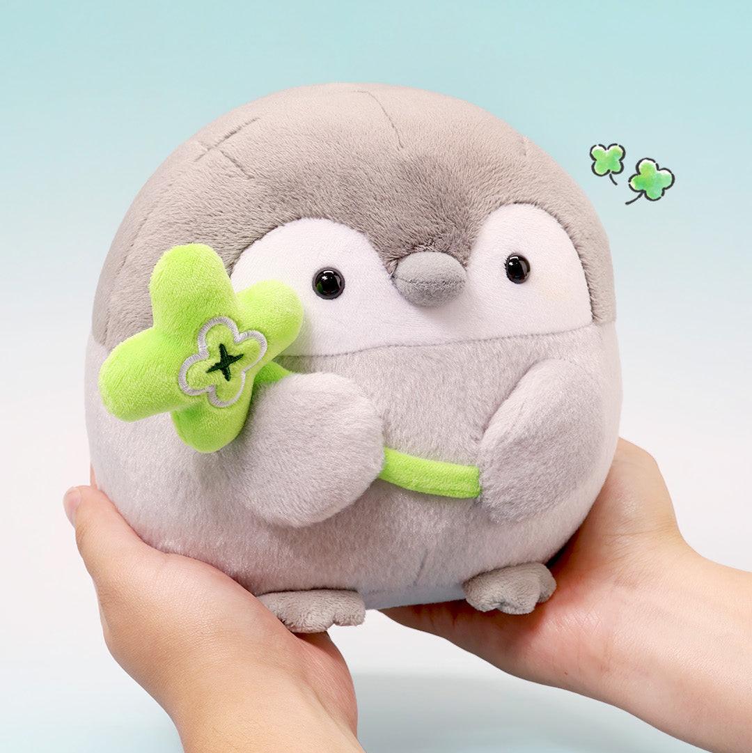 Star Wand Penguin Plush: Person holding a Koupen Chan Penguin Plush 6 inch holding a Green Clover Wand. Official licensed toy, made from soft Polyester Fiber.