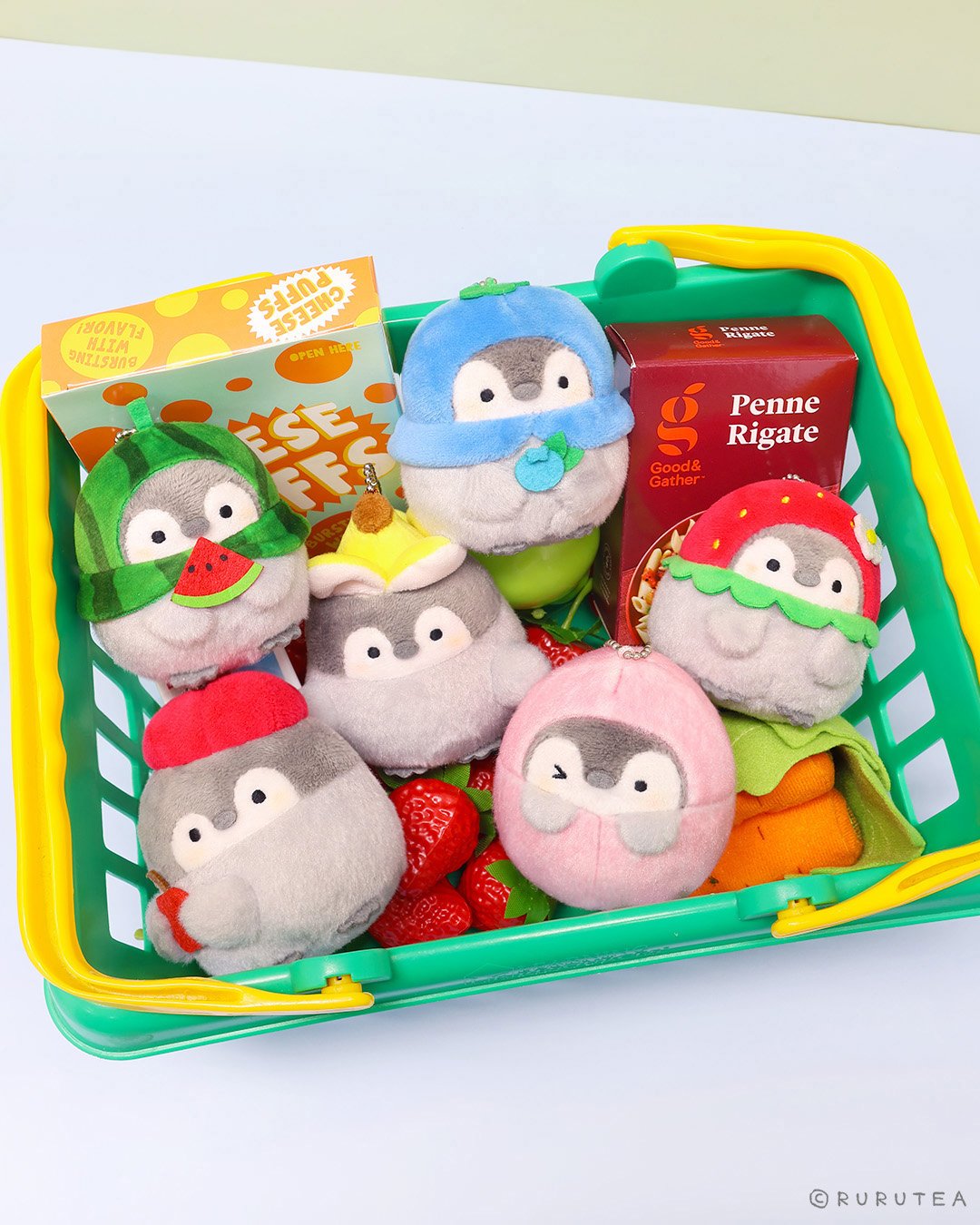 Koupen Chan Plush Keychain Set: Official licensed Koupen Chan plush keychains in a shopping basket, featuring watermelon, strawberry, banana, blueberry and pink peach designs