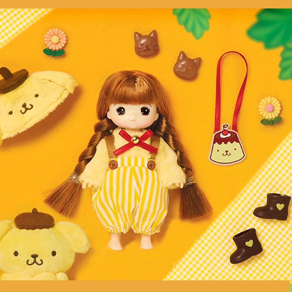 Officially licensed Sanrio and Little Mimi Collaboration Doll Collection featuring Pompompurin doll featuring a mini doll with curly brown hair wearing a fuzzy yellow Pompompurin plush hat with a brown beret, a yellow and white striped suspender romper over a soft cream top with a red ribbon collar, brown boots, and a pudding shaped crossbody bag, ideal for adult kidult collectors and doll enthusiasts as a nostalgic rare collectible display piece.