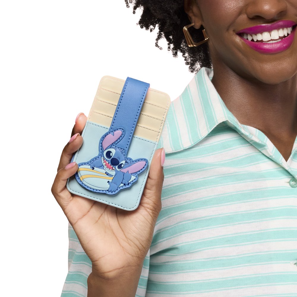 Officially licensed Disney Lilo & Stitch surfing faux leather card case featuring a light blue and cream color block design with a secure snap strap