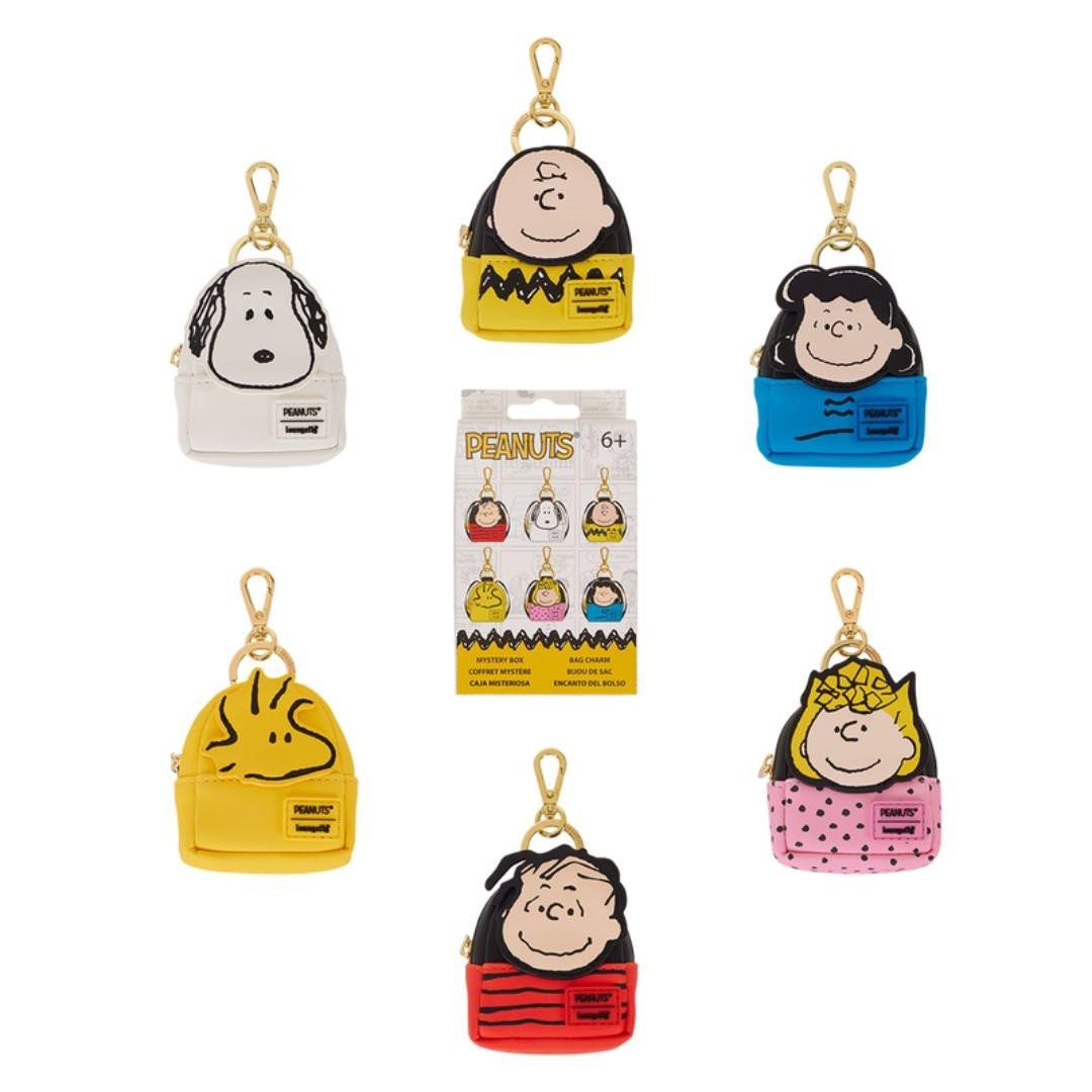 Set of Peanuts-themed keychains and pouches on a white background