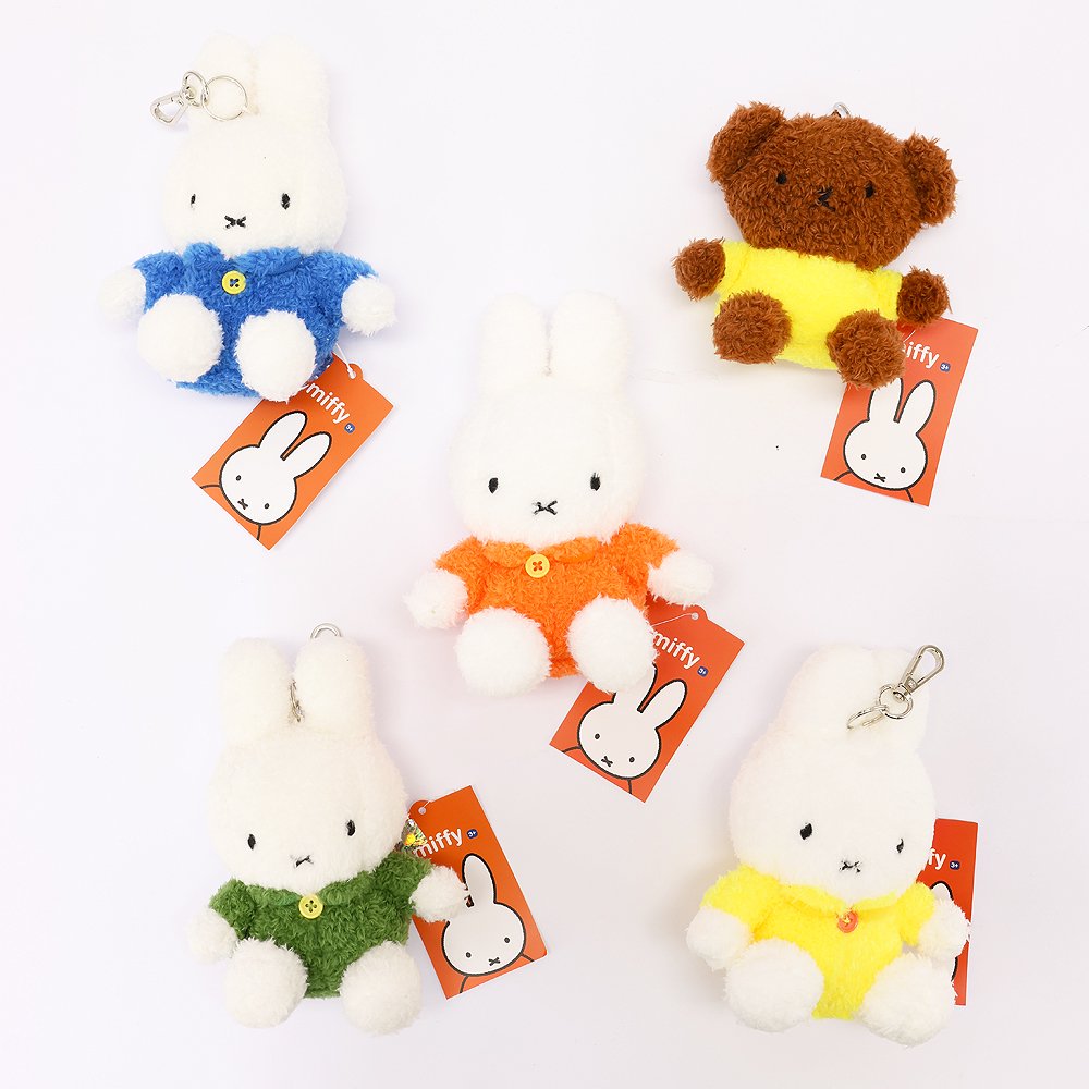 An officially licensed Class of 2026 Miffy graduation gift set featuring yellow, orange, green, and blue color Miffy plush and Boris plush wearing black graduation caps. The characters are arranged like a bouquet with silver star balloons and "Congrats Grad" decorations.