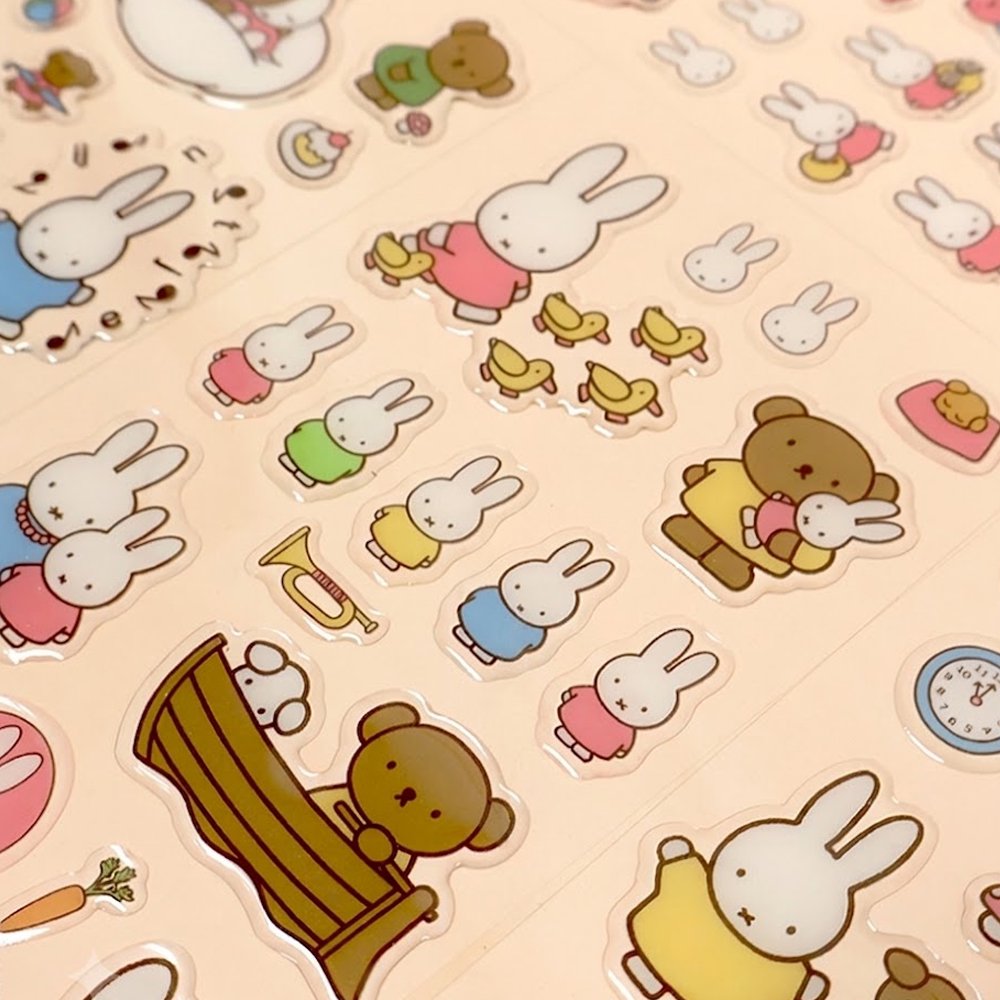Four different officially licensed Miffy Epoxy Daily Sticker sheets, each featuring various colorful illustrations of the white bunny character and her animal friends. The stickers have a smooth, raised epoxy texture and depict playful scenes like Miffy riding a bicycle, sitting with a giraffe, and boating with a bear.