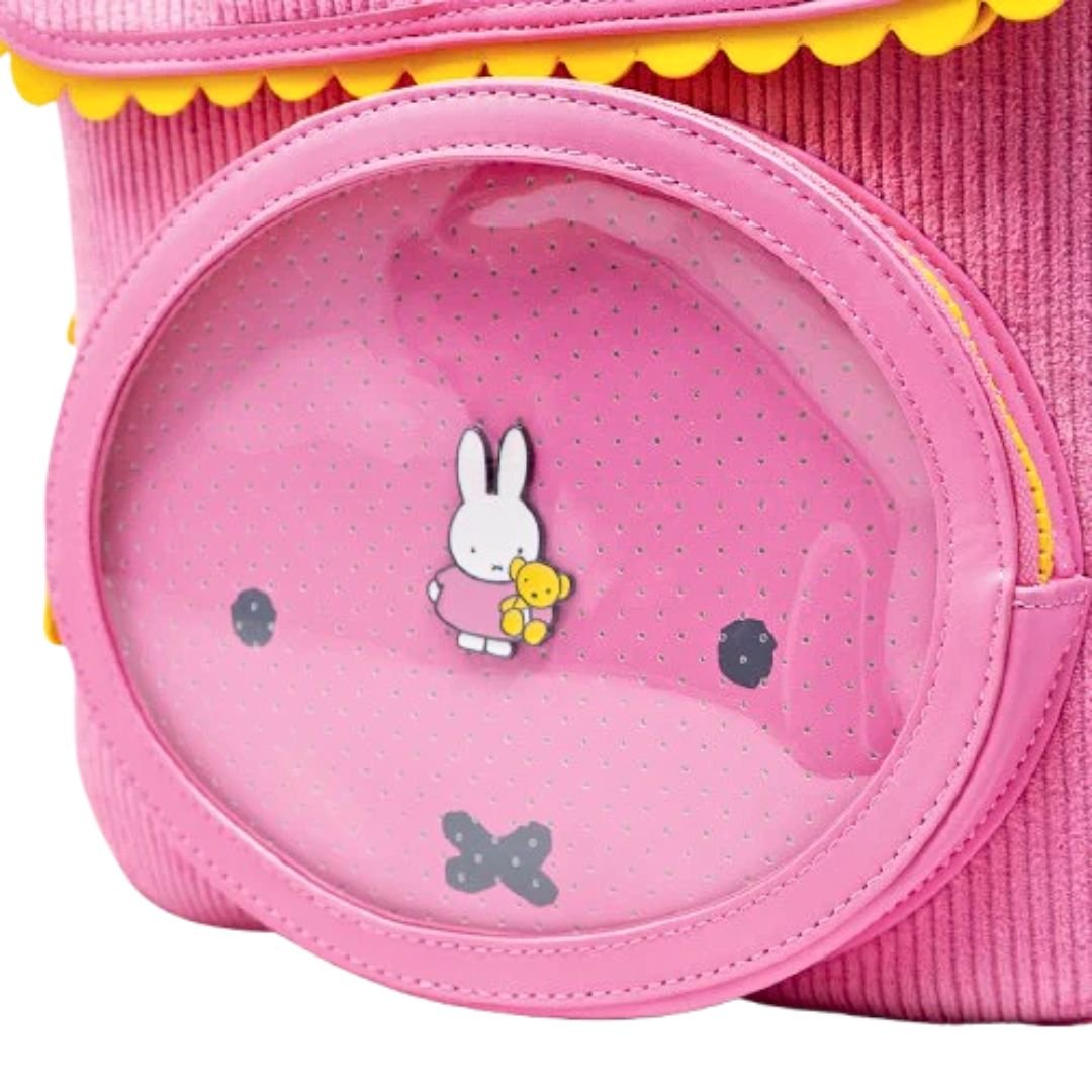 Officially licensed pink corduroy Miffy backpack. The front panel has a circular window pocket with Miffy's face, and the top flap is shaped like rabbit ears with a scalloped yellow trim.