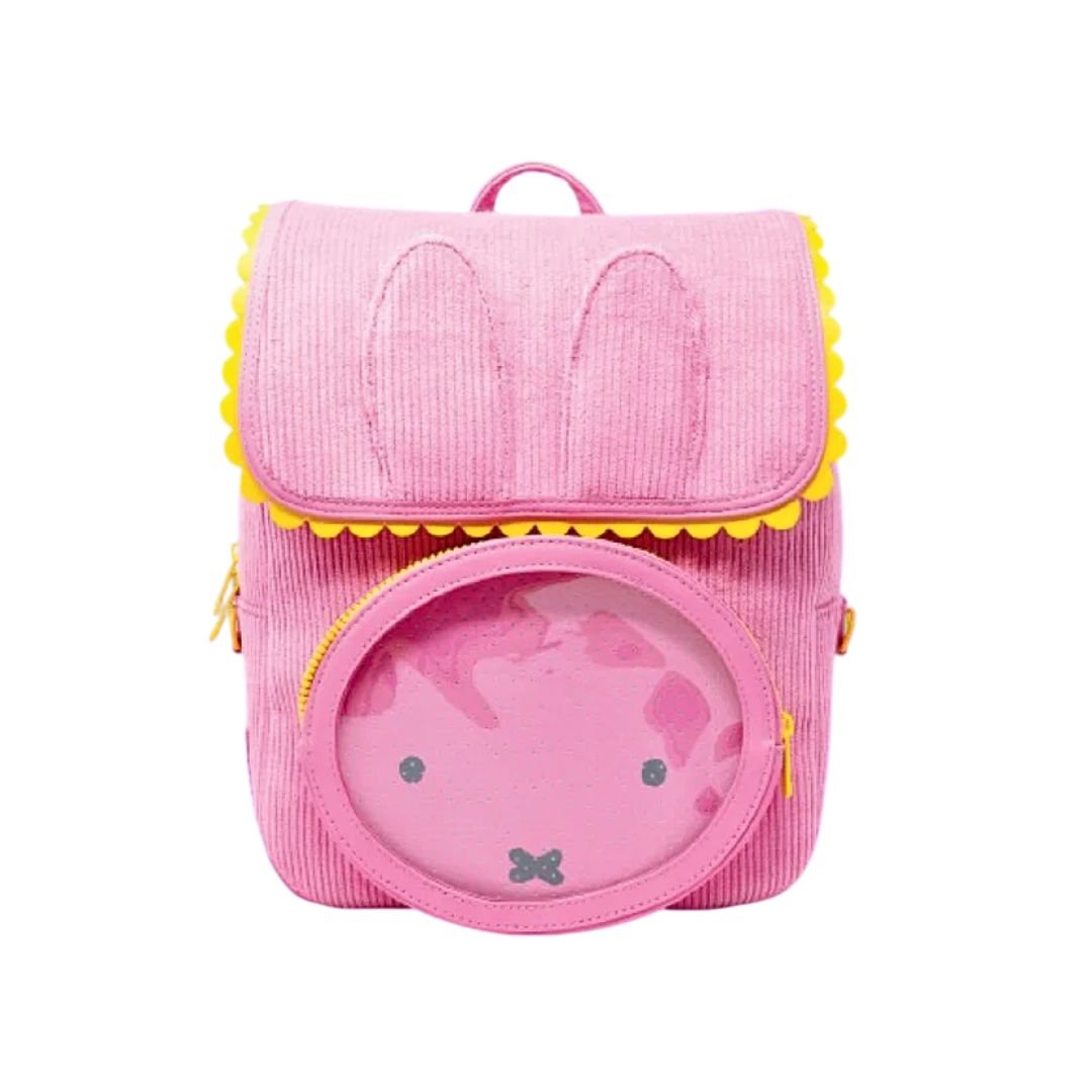 Officially licensed Miffy backpack in pink corduroy. The front features Miffy's face on a round clear window pocket, and the flap is shaped like bunny ears with yellow trim.