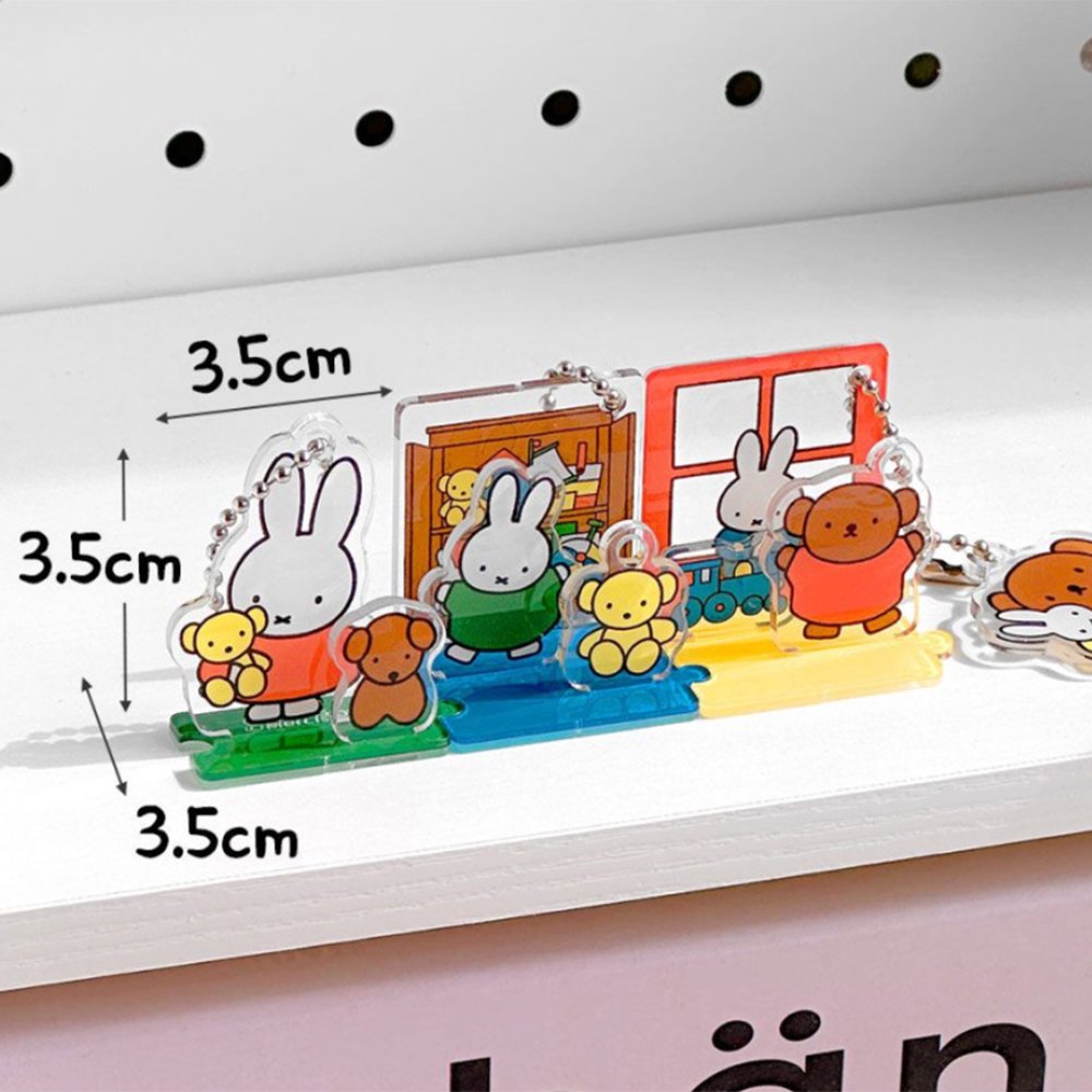 Officially licensed Miffy and Friends acrylic diorama set featuring pop-out characters like Miffy and Boris Bear, colorful scenery pieces, and silver ball chains for keychain use.
