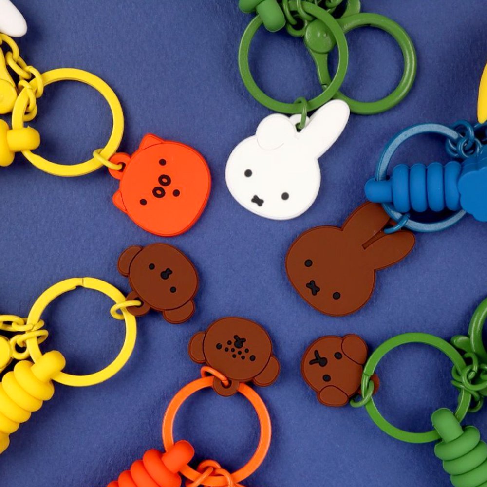 A collection of Miffy dream figure keychains shown with orange, yellow, white, green, and blue clasps.