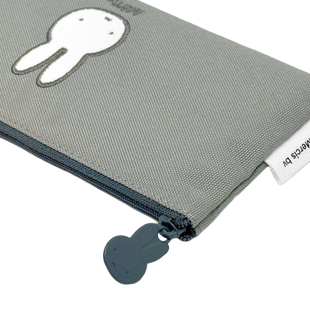 Two slim canvas pencil cases: one grey featuring an embroidered Miffy face and one tan featuring Boris Bear. Both cases have character-shaped zipper pulls.