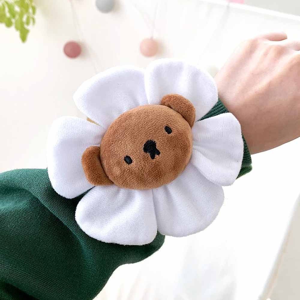 A collection of Miffy Friends Flower Plushies stuffed animals in various colors, each designed to look like a flower with animal faces in the center.