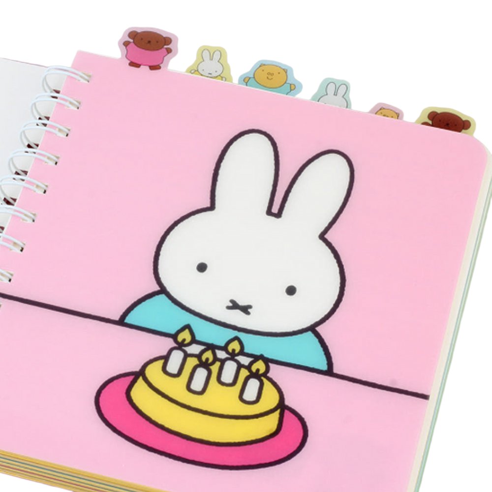 Officially licensed Miffy spiral notebooks in pink and blue, featuring die-cut character tabs of Miffy and friends along the top edge and white spiral binding.