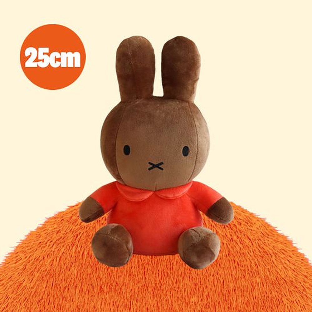 Miffy Melanie Brown plush toy with a red shirt on an orange cushion, with a '25cm' label in the corner.
