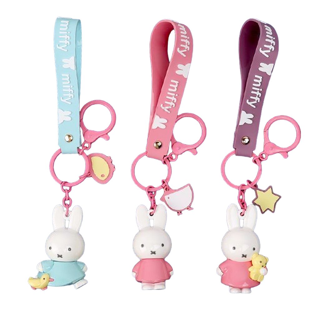 Three Miffy character keychains in pastel blue and pink, featuring 3D Miffy figures with matching silicone wrist straps and lobster clasps.