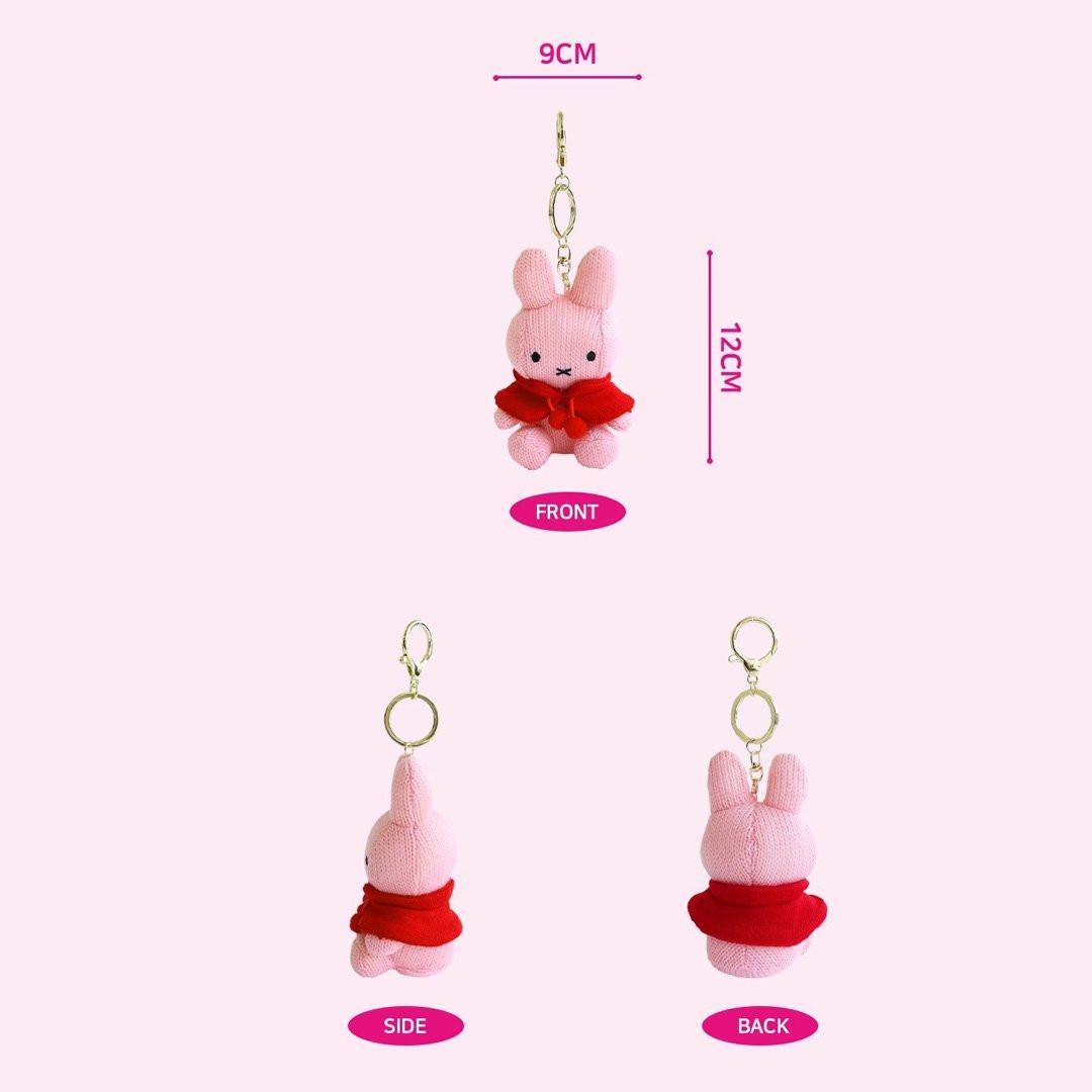 Officially licensed by Miffy pink knit Plush keychain in a red cape on a white background. She's perfect for ornament , displaying, bag decoration or gifting Christmas to Miffy fans of all ages.