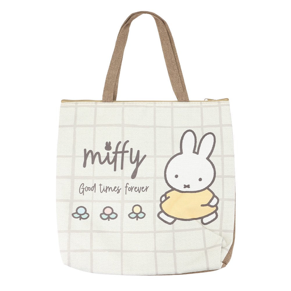 An officially licensed Miffy canvas tote bag with zipper closure, the bag has a grid pattern with Miffy and "Good Times Forever" text.