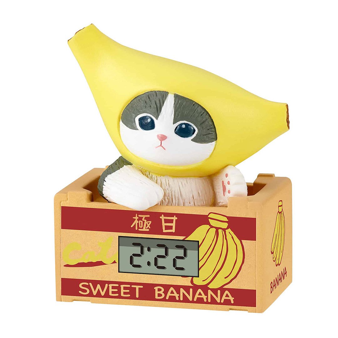 Mofusand blind box miniature clock, a collectible cat figure in a banana costume, ideal for kawaii Japanese stationery and desk accessories.