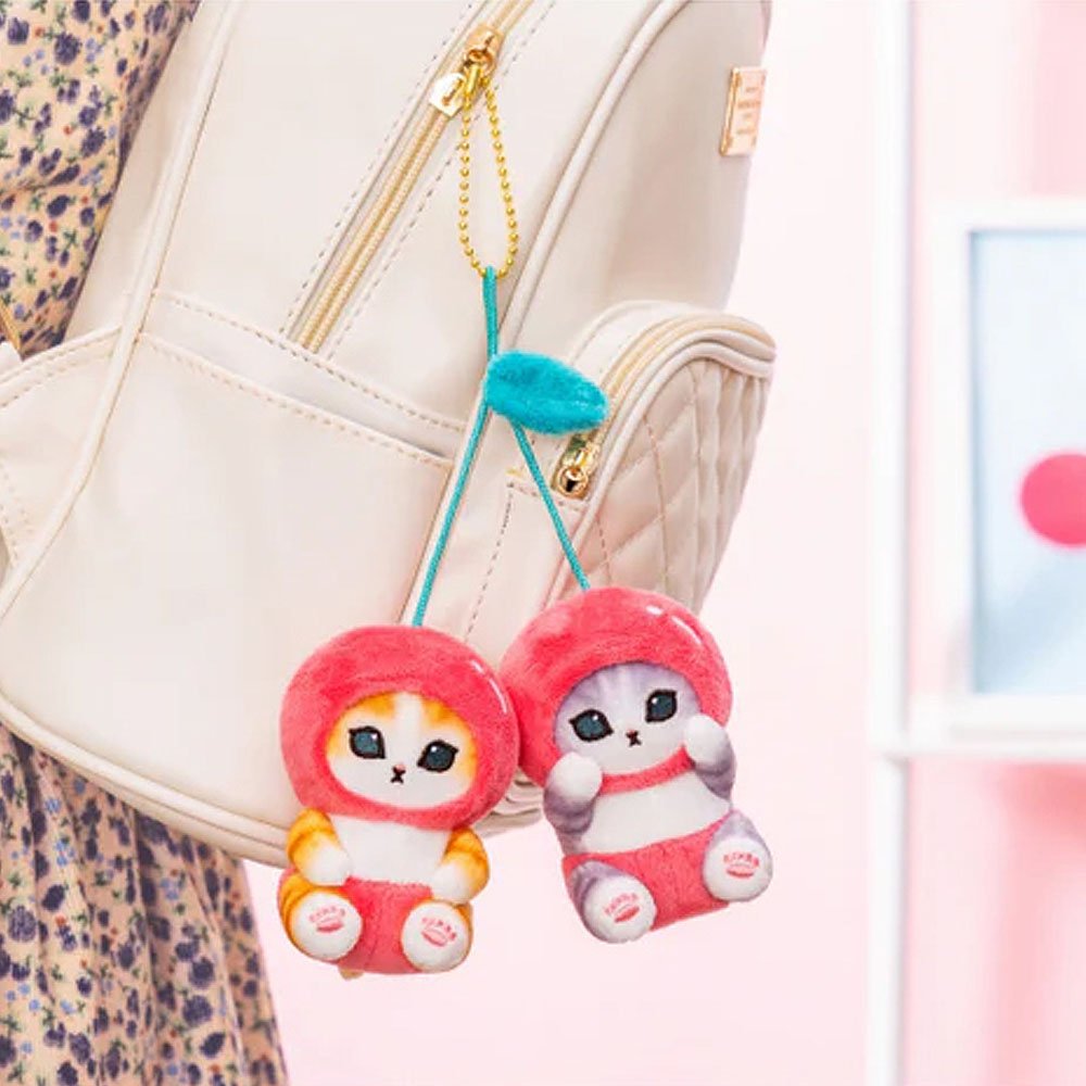 Cute Mofusand cherry plush with a clip hanging from a bag