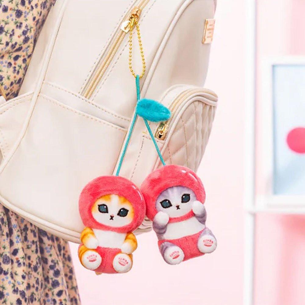 Cute Mofusand cherry plush with a clip hanging from a bag