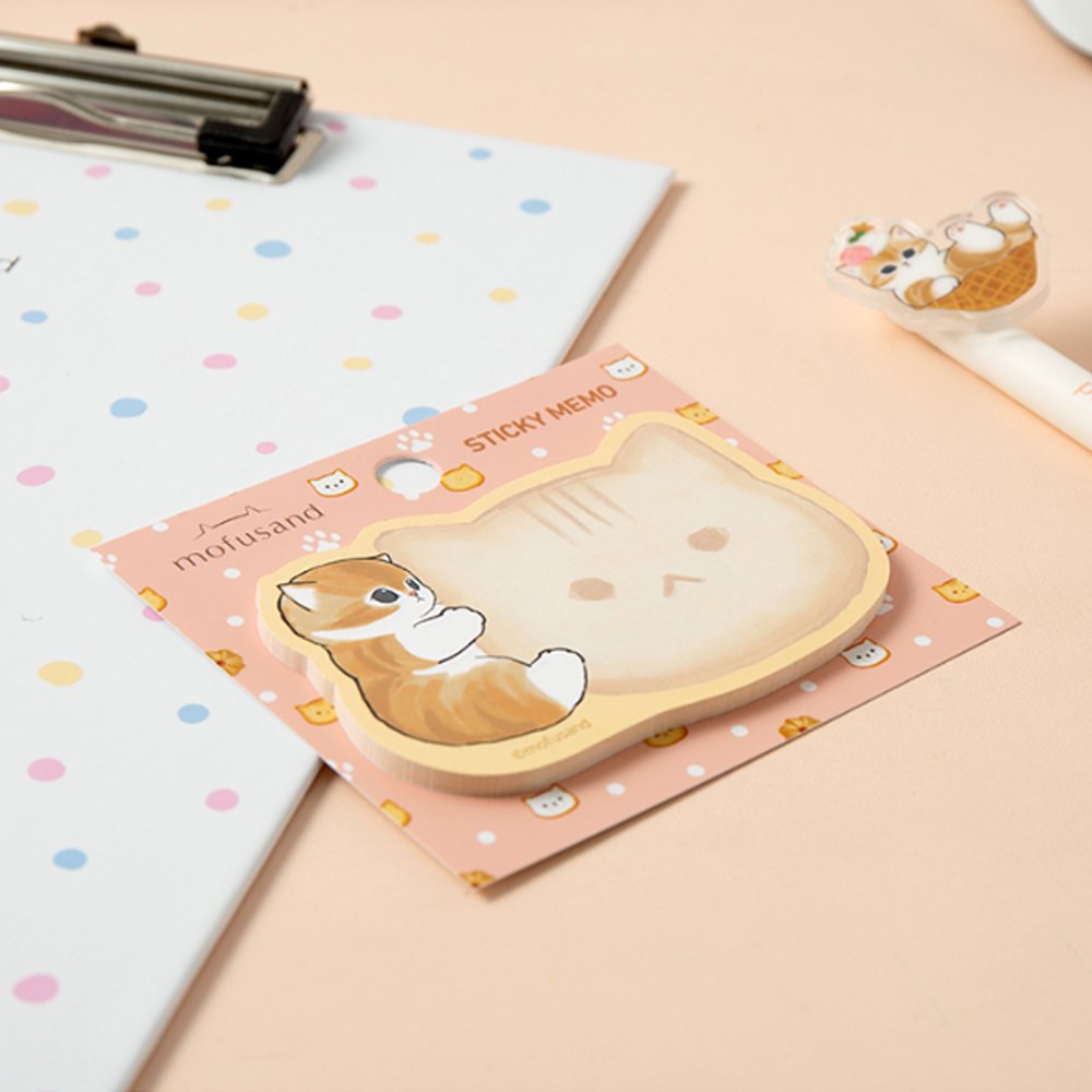 An officially licensed Mofusand die-cut sticky memo pad featuring a brown tabby kitten hugging a cat-shaped writing note