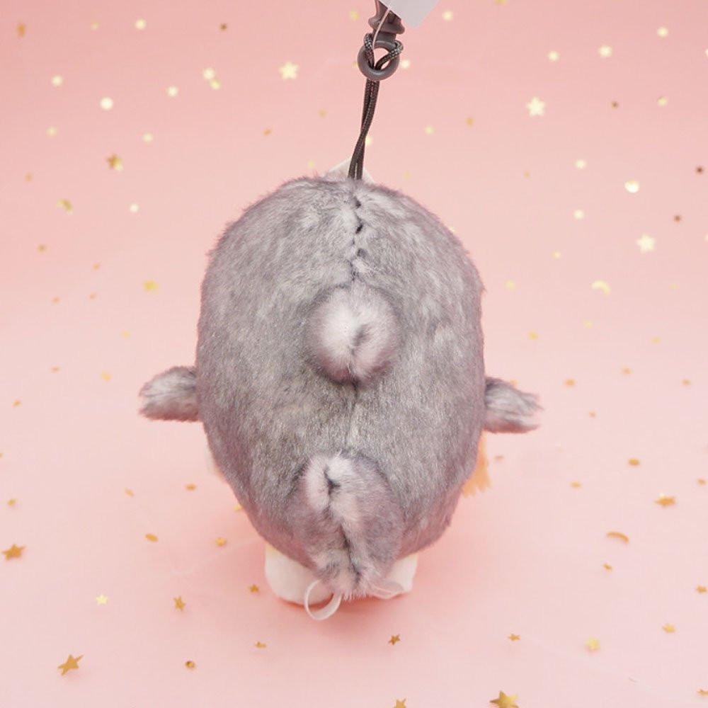An officially licensed Mofusand shark cat plush keychain featuring a fluffy cream tabby kitten wearing a gray shark onesie with embroidered details