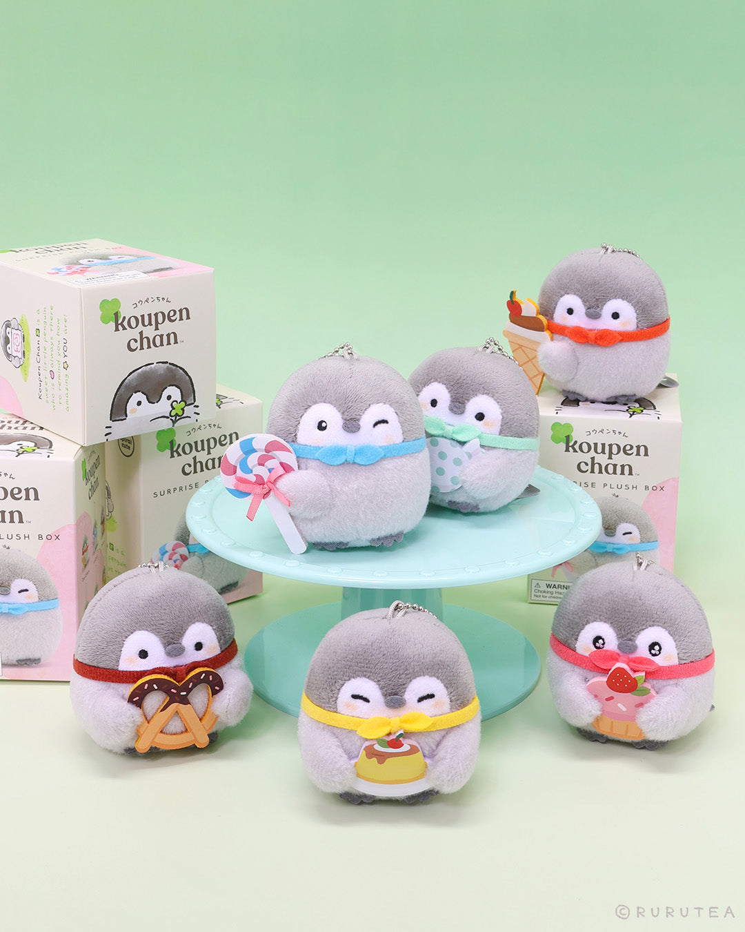 Officially licensed Spiralcute Koupen Chan Sweet Treats Plush Blind Box collection featuring six cute grey penguin plushies with colorful desserts such as candy, ice cream, pudding, cupcake, lollipop, and pretzel, perfect for kidult bag charms and kawaii aesthetic backpack accessories.