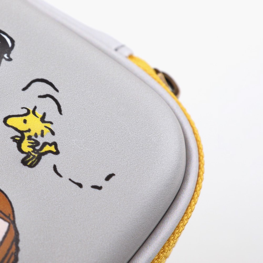 Officially licensed Peanuts hard shell pencil cases in yellow, red, pink, and grey featuring Snoopy, Charlie Brown, and friends