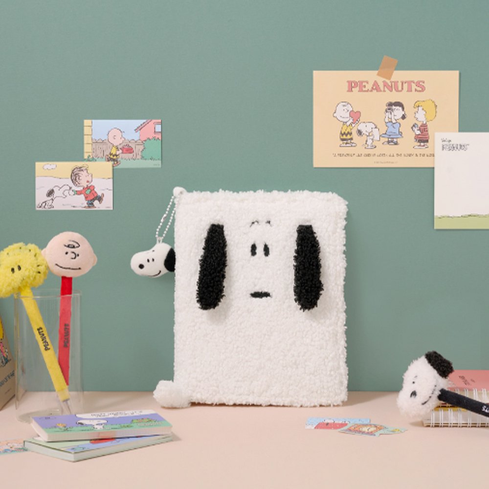 Officially licensed Peanuts plush keychains featuring the face of Snoopy attached to a white ball chain.