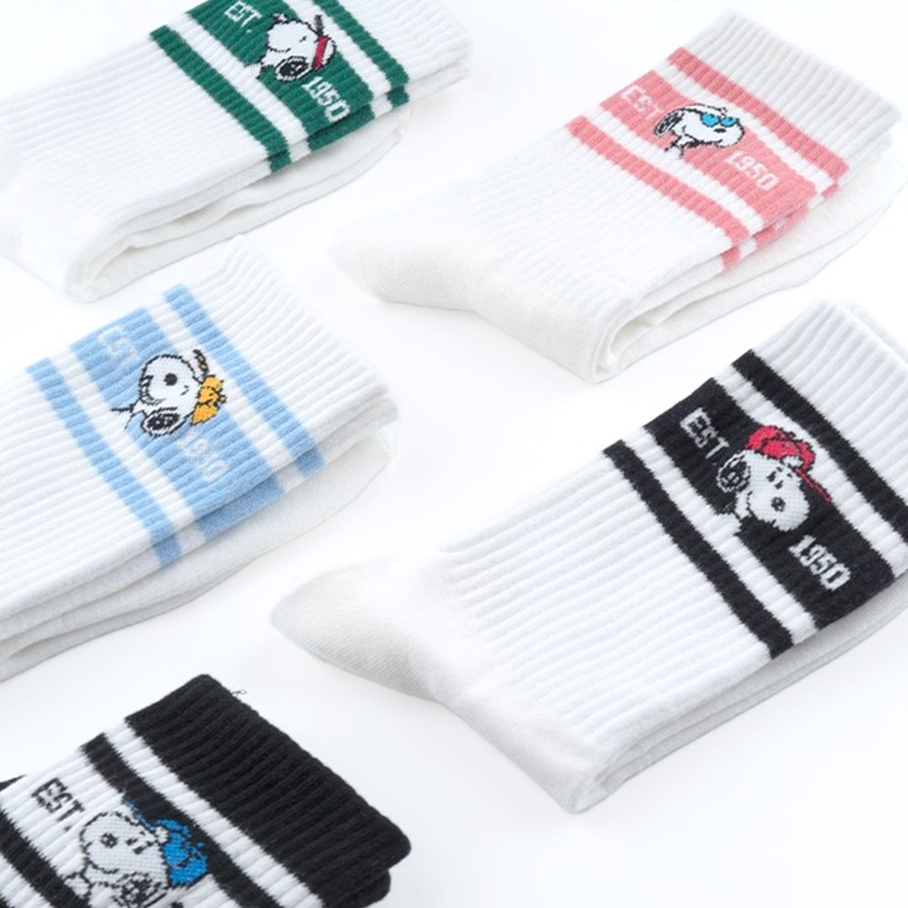 A set of five athletic crew socks in colored stripes of black, pink, green, light blue, and white. Snoopy's face wearing matching colored caps. All socks feature "EST. 1950" text and "SNOOPY" branding on the soles.