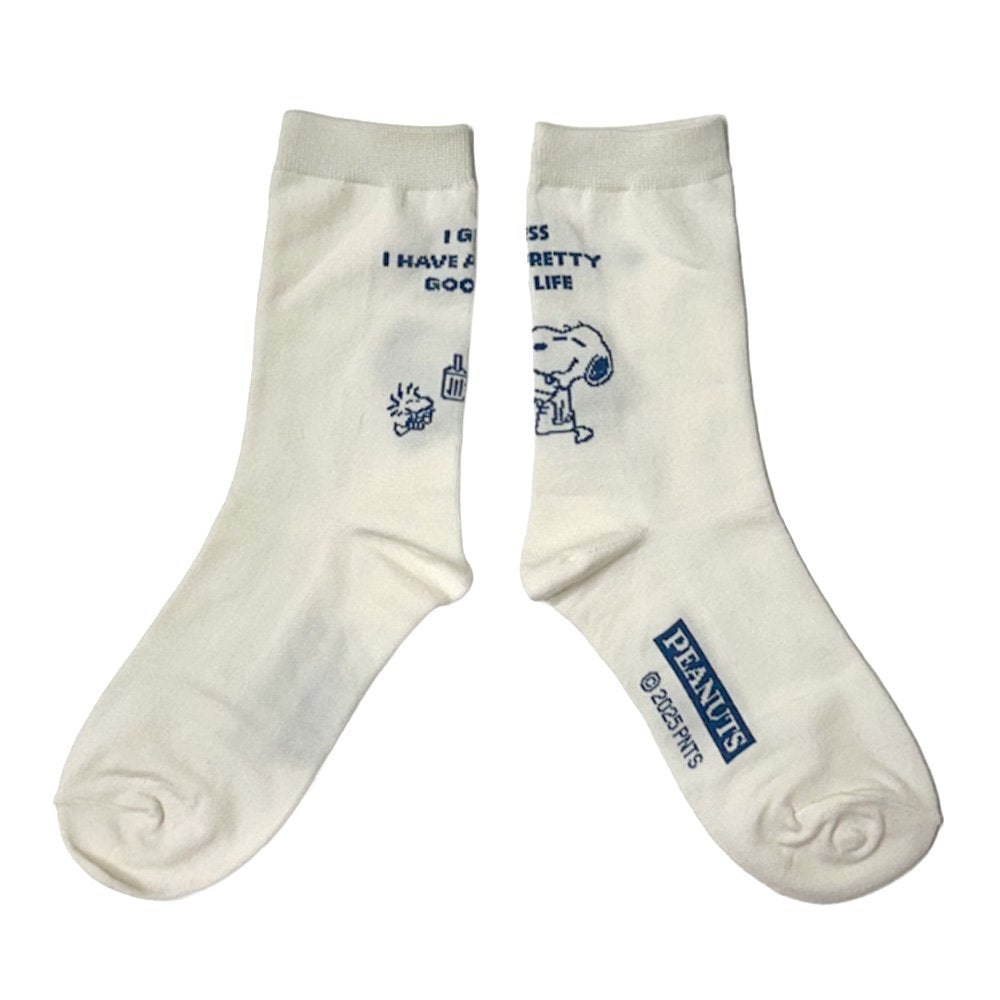 A set of three crew-length socks in white, beige, and black, celebrating Snoopy's 75th anniversary. Features clean, line-art illustrations of Snoopy and Woodstock in their most recognizable poses.