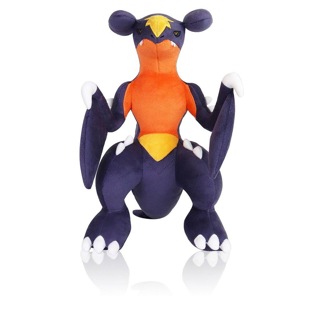 Pokemon Garchomp Plush toy of a character with orange, purple, and yellow colors on a white background
