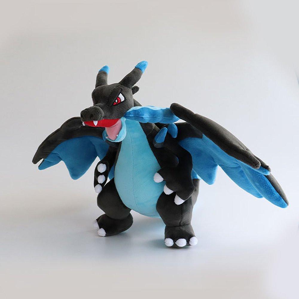 Office Licensed. Pokemon Mega Charizard plush toy of a dragon-like creature with blue wings and black body on a white background. Perfect for displaying, or gifting Christmas to Pokemon fans of all ages.