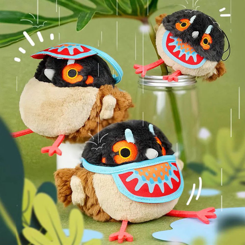 A round Cabot's Tragopan bird plush keychain with dark grey and brown fur, featuring bright orange embroidered eyes and long red legs