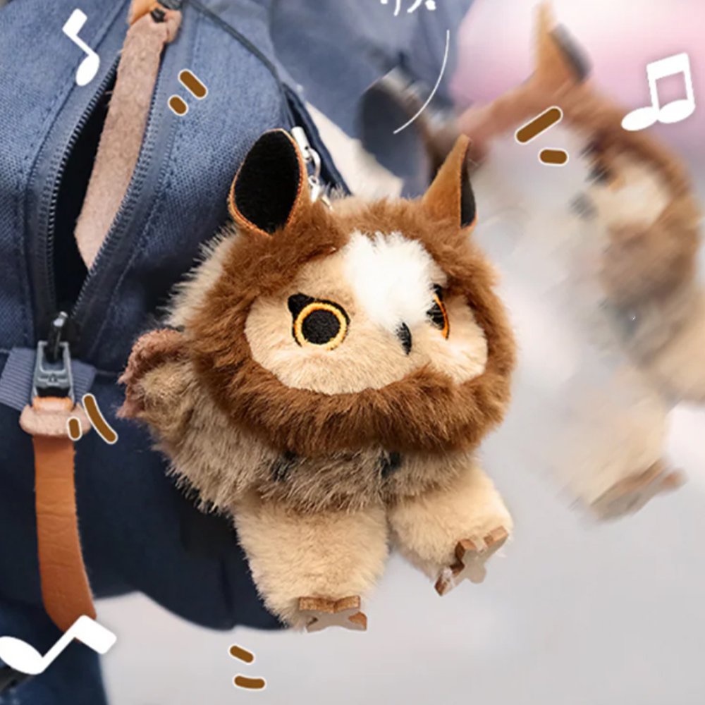 A round, fluffy brown Long-eared Owl bird plush keychain with a cream-colored face and golden eyes