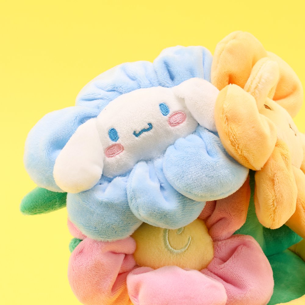 An officially licensed Sanrio plush bouquets featuring Cinnamoroll as soft, colorful flowers inside plush pots. The yellow planter is beautifully embroidered with character name.