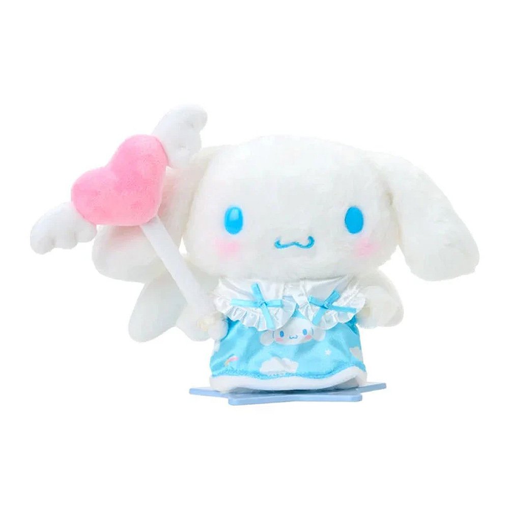 A Sanrio Pitatto Friends M-size doll outfit called the "Angel Set". The set includes a light blue satin dress with cloud and rainbow prints, white ruffles, and blue bows. Above the dress is a pink plush heart with white wings on a stick. Large white plush wings are shown behind the dress.