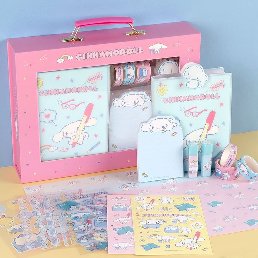 Cinnamoroll themed stationery set displayed in a box, including a diary, stickers, seals, wrapping paper, masking tape, a memo pad, a clip, and stamps.
