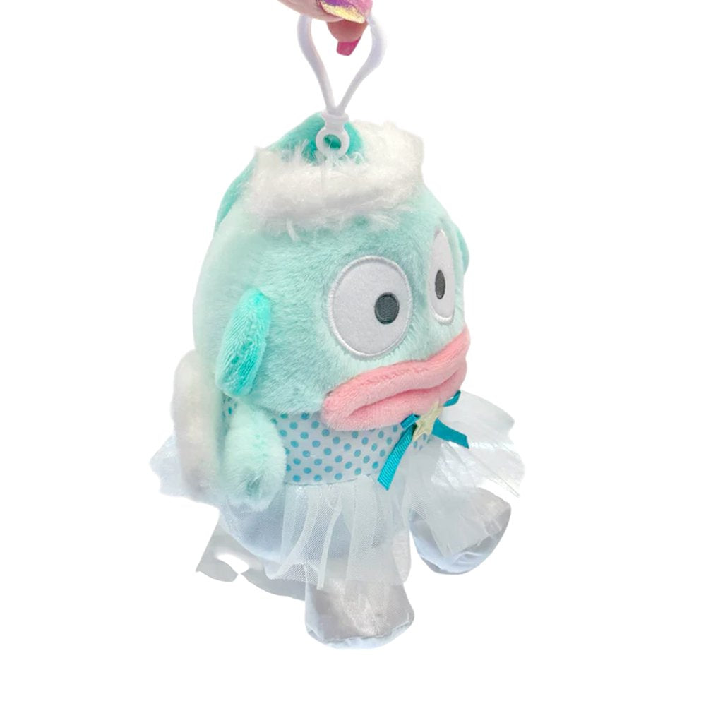 An officially licensed Sanrio Hangyodon plush keychain featuring the character in a teal ballerina tutu and polka-dot bodice with a yellow star accent. The plush includes fluffy white head trim, angel wings, and a white plastic clip for easy attachment.